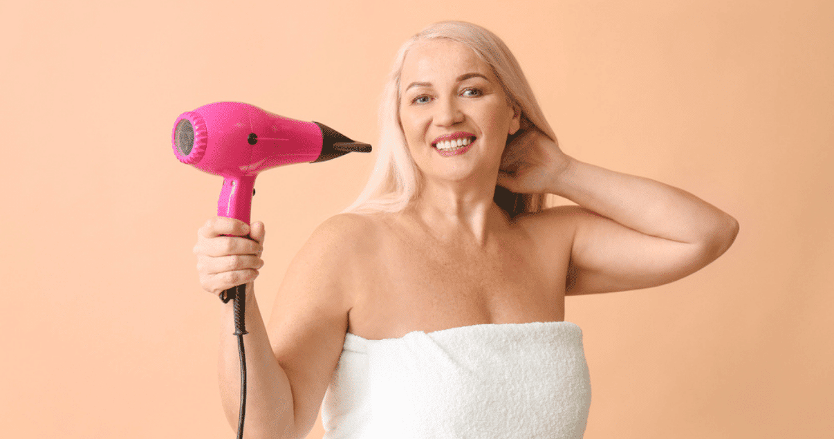 Middle aged woman grooming hair before storing wig